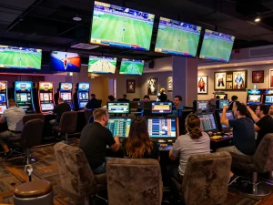 Soi kèo nhà cái action as bettors analyze live sports and betting lines in a lively casino.